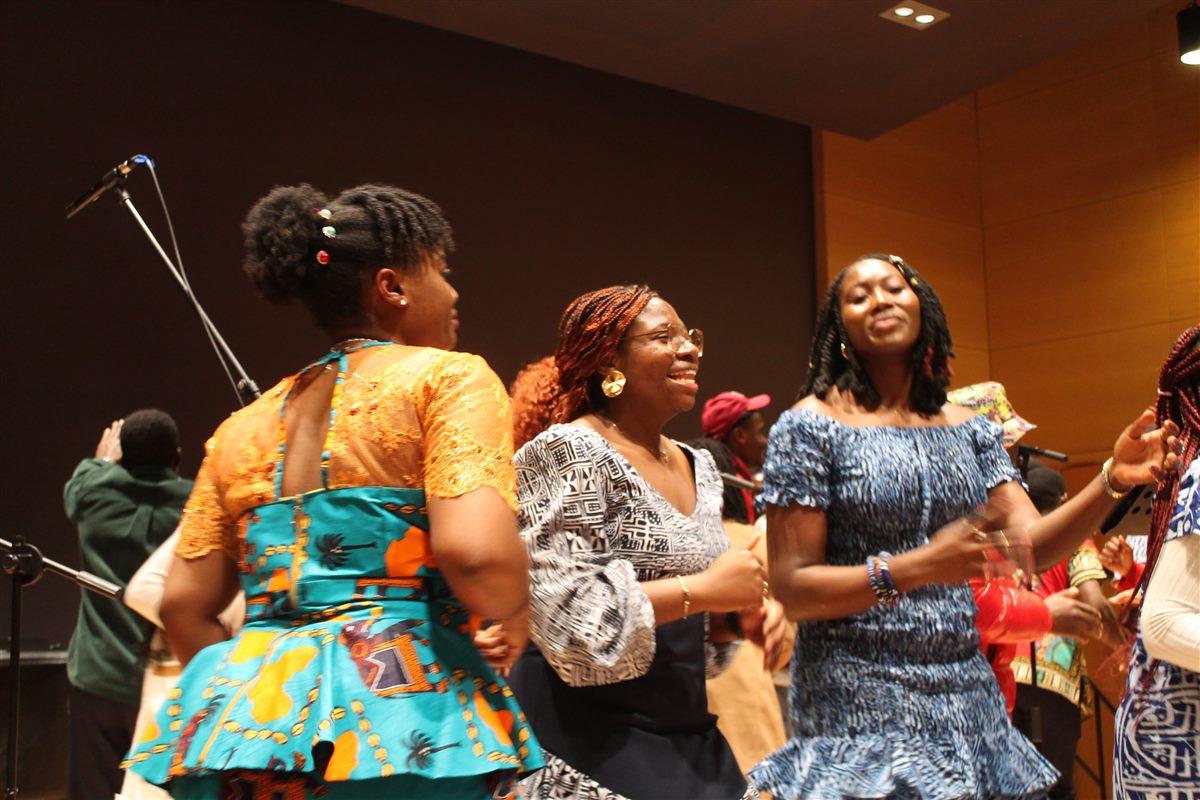 Choir members celebrating through movement